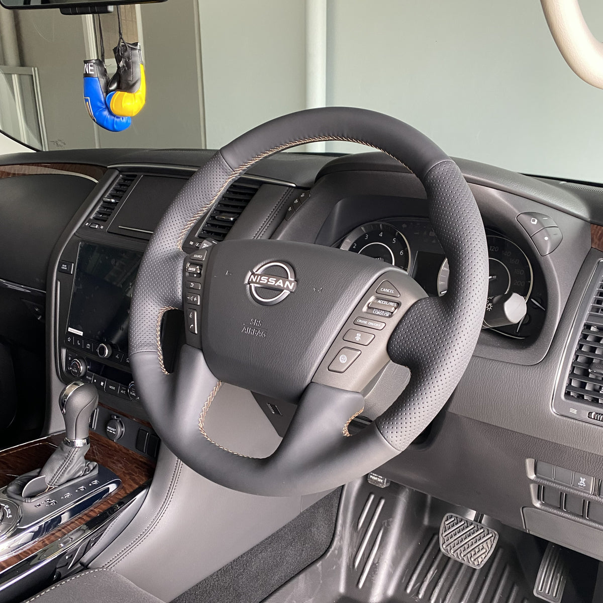Nissan Patrol Y62 Steering Wheel Wrap – Black Leather (smooth top, perforated sides), Brown stitch