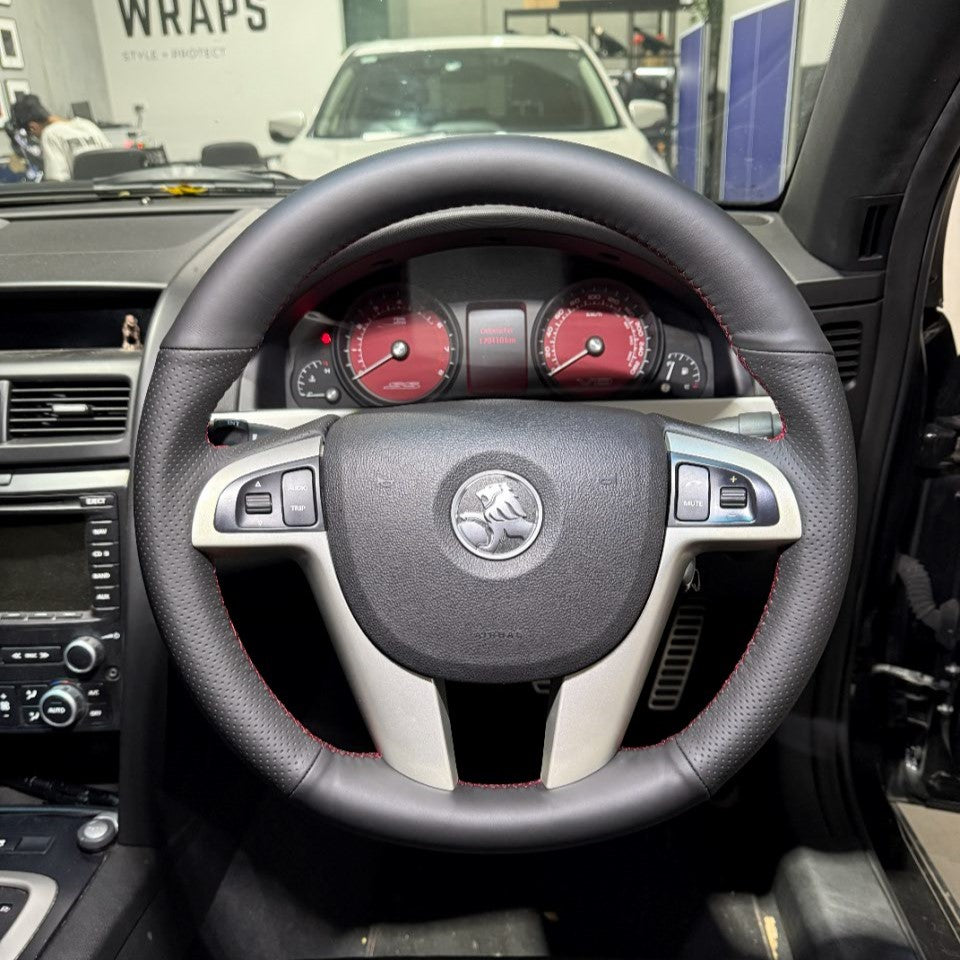 Holden Commodore VE (2006–2013) Steering Wheel Wrap – Black Leather (smooth top, perforated sides), Red stitch