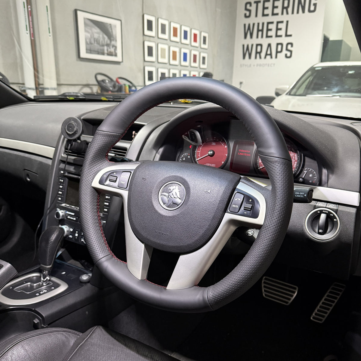 Holden Commodore VE (2006–2013) Steering Wheel Wrap – Black Leather (smooth top, perforated sides), Red stitch
