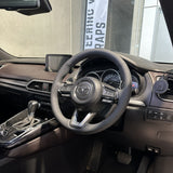 Mazda 3 / CX- (2016-2024) Steering Wheel Wrap – Black Leather (smooth top, perforated sides), Grey stitch