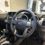 Toyota Prado 150 Series (2010–2015) Steering Wheel Wrap – Black Leather (smooth top, perforated sides), Black stitch