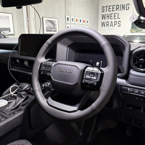 Toyota Prado 250 Series (2024+) Steering Wheel Wrap – Black Leather (smooth top, perforated sides), Grey stitch