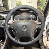 Holden Commodore VX/VT Series Steering Wheel Wrap – Black Leather (perforated top, smooth sides), Black stitch